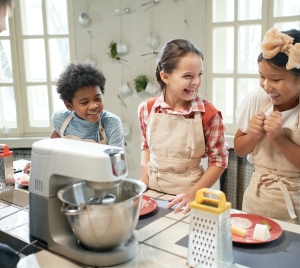 Children learning to cook together